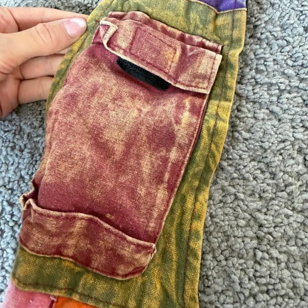 Patchwork hippie style bag with peace sign, star, and floral appliqués